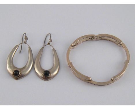 A white metal (tests silver) and black enamel bracelet, marked 835, approx 18cm, 26.3 gms, together with a pair of white meta