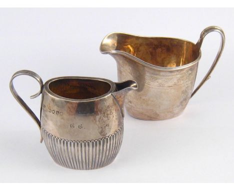 Two Victorian silver service cream jugs, William Hutton, London 1881, and I. B., Birmingham, 1882. wt. 162gm. 