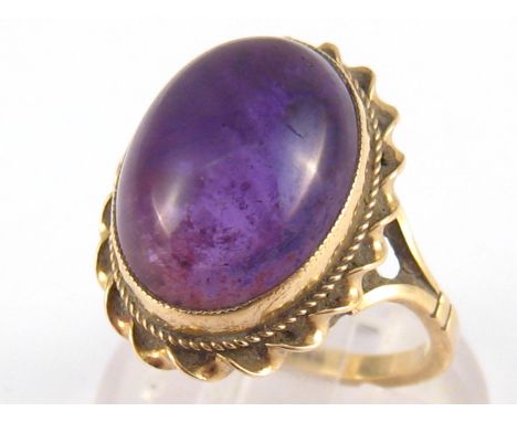 A 9 carat gold cabochon amethyst ring, amethyst approx. 15.5 x 12mm, ring size O, 4.6 gms.