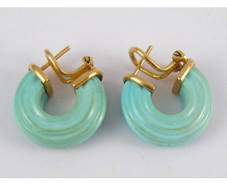 A pair of yellow metal (tests 18 carat gold), turquoise blue ceramic earrings, approx. 2cm, 10 gms.
