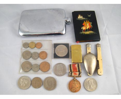 A mixed lot comprising a vintage Zippo lighter, a WWI Special Constabulary service medal, a campaign spoon and fork, a hip fl