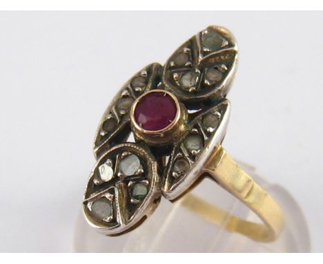 A yellow metal (tests 14 carat gold) ruby and diamond ring, size O ½ ,3.7 gms.
