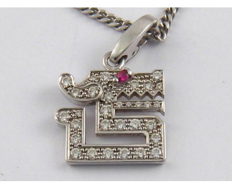 Cartier. An 18 carat white gold diamond and ruby pendant and chain by Cartier, the pendant designed as a dragon, signed Carti
