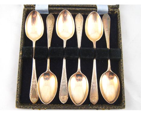 A boxed set of six decorated Celtic point silver tea spoons, Sheffield, 1896. 