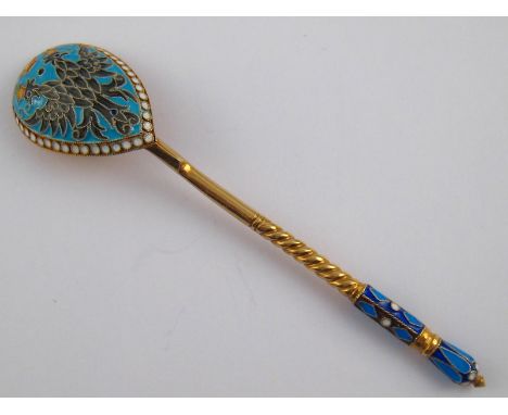 A gilt metal (tests silver) and enamel spoon, in the Russian style, unmarked, approx 12cm long, 24.5 gms.
