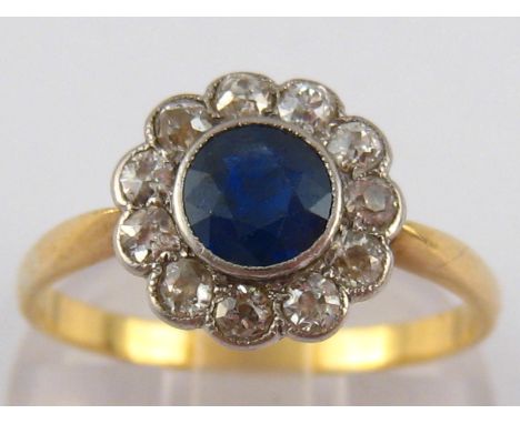 An 18 carat gold sapphire and old brilliant cut diamond ring, the sapphire of good colour measuring approx 5.4 x 3.3mm deep, 