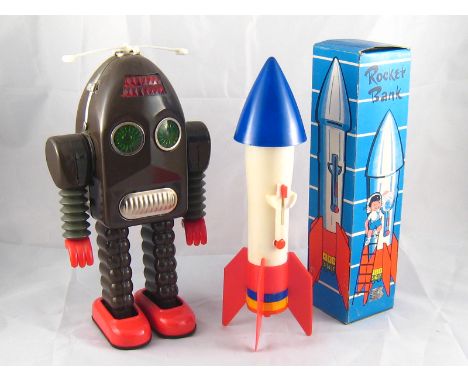 A 1960's Rocket Bank children's money box, made in Hong Kong, in original box 28.5cm, together with a battery operated reprod