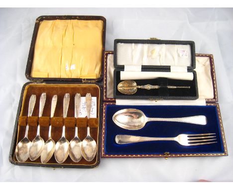 A pair of Old English feather edge spoon and fork by Goldsmiths and Silversmiths, London 1916, in original case, together wit
