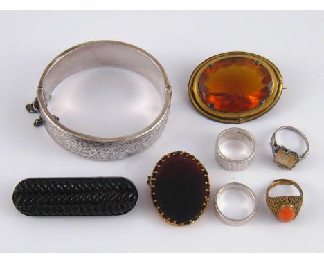 A mixed lot comprising a silver bangle, four silver rings and three brooches.

