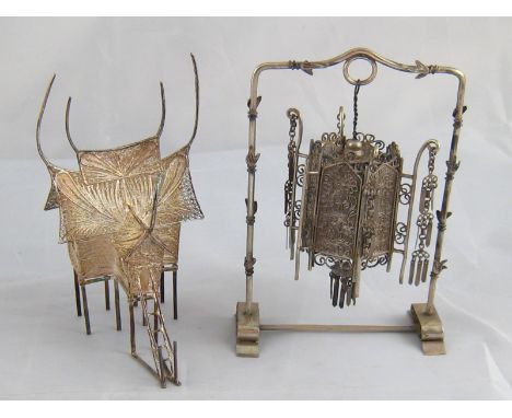 Miniature Chinese silver. A lantern hanging from a frame, unmarked, tests silver, and a filigree house on piles, stamped 900.