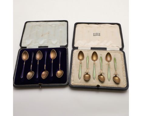 one set decorated with dark blue enamel, by Marius Hammer of Bergen, the other with green enamel and import marks for London 