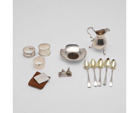 comprising of an Edwardian cream jug, by Haseler Brothers, London 1901, a set of 5 George III spoons, with gilt bowls, by Pet