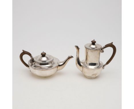 of circular form, with 'C'-scroll handles and wooden turned finials, by Cecil R Walker, London 1927; the coffee pot 7.1" (18.