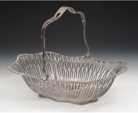 An open silver fruit basket of shaped rectangular form with swing loop handle, pierced decoration and beaded borders, with pr