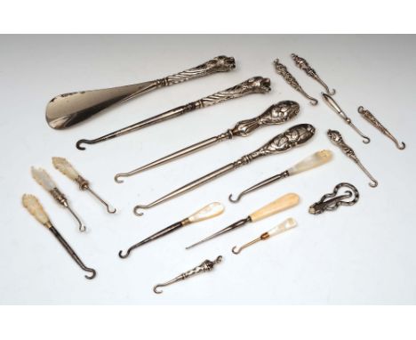 A collection of miscellaneous silver mother of pearl handled button hooks together with a shoehorn etc in various styles and 