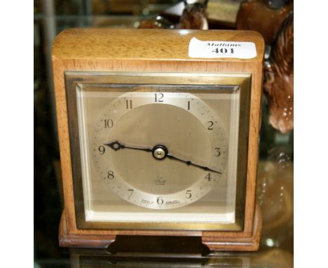 An Elliott mantel clock with French movement and an oak canteen of cutlery and other assorted cutlery