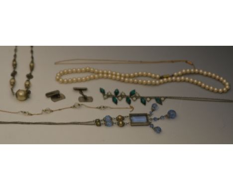 A small quantity of miscellaneous costume jewellery including necklaces, a 9ct gold chain of fine link form, a pair of silver