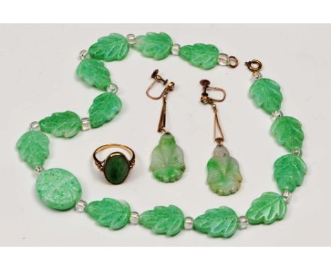 A small collection of jade jewellery including a pair of drop earrings with seed pearl settings and 9ct gold mounts, a gold (