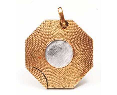 A 9ct gold cigar cutter of octagonal form with engine turned decoration