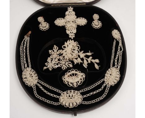 A suite of seed pearl jewellery comprising a necklace, brooches, earrings etc by Pickett of Oxford Street, London, in origina