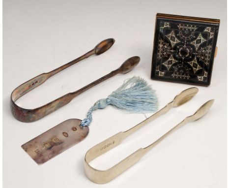 One pair of silver sugar tongs together with a pair of silver plated tongs, a silver identity pendant and a compact of square