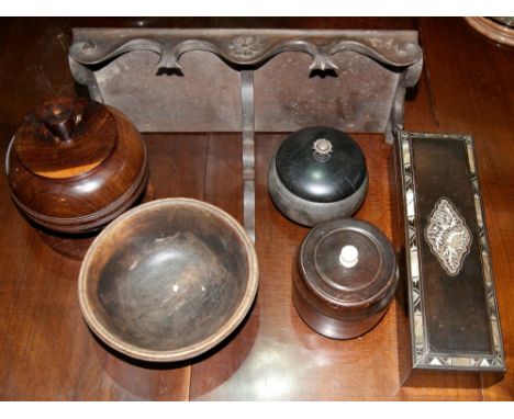 A small box of miscellaneous including carved hardwood lidded pots, an open bowl, a fan box with mother of pearl inlaid decor