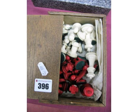 A Stained Bone Chess Set, in oak box.