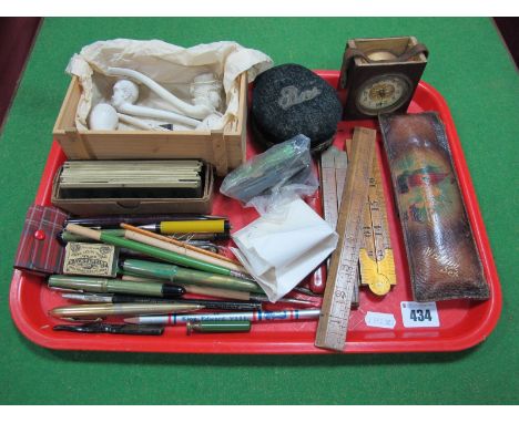 Wooden Folding Rulers, pens, glass lantern slides, pin box, clay pipes, clock, etc:- One Tray