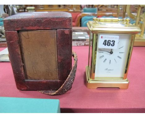 A French  R & Co. Brass Cased Carriage Clock, with carrying handle, 10cm high, in a maroon leather travelling case and anothe