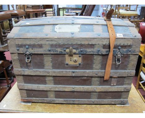 An Early XX Century Domed Top Trunk, with iron wood strapwork. 