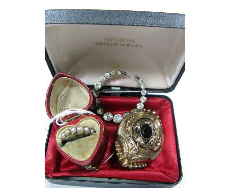 A XIX Century Brooch, oval collet set to the centre, with glazed locket verso, inscribed "M E Lambert from J E A & G Yewdall 
