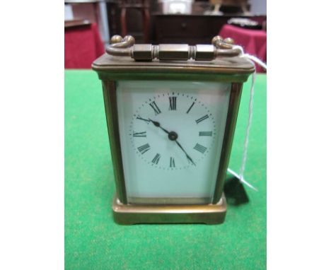 An Early XX Century French Carriage Clock, with carrying handle and enamel dial with Roman numerals. (Damaged)