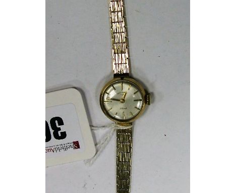 Rotary; A 9ct Gold Cased Ladies Wristwatch, the signed dial with baton markers, to integral textured bracelet with 9ct gold c