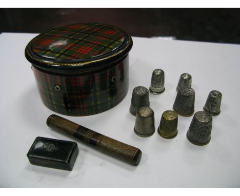 A Tartan Ware Thread Box, (lacking contents) of circular form with pull off lid; together with assorted thimbles and a black 