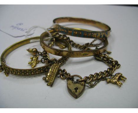 A Charm Bracelet, to heart shape padlock clasp; together with two hinged bangles and a (possibly) Russian Orthodox Christian 