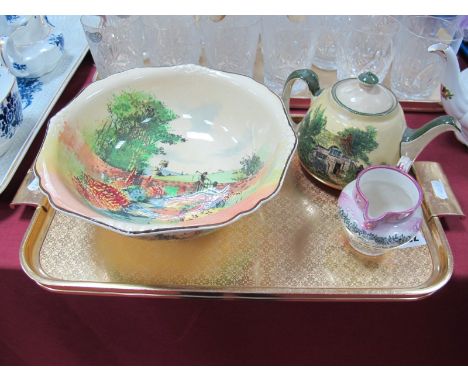 A C.1930's  Royal Doulton Series Ware Bowl, depicting a man with scythe in a country garden, D4932; a similar teapot and a Su