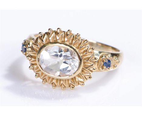 9 carat gold ring, with a pale blue stone