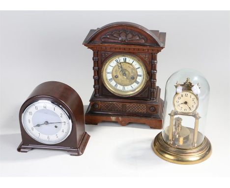 A 1930s bakelite mantle clock, 20 cm high, together with a wooden mantle clock, 37.5 cm high, and a domed anniversary clock, 