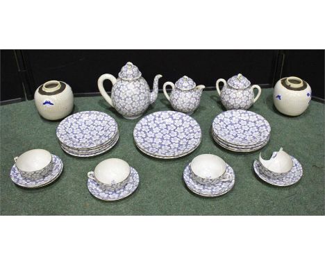 Twentieth century Japanese porcelain tea service, consisting of a tea pot, four tea cups, milk jug and sugar bow, six saucers