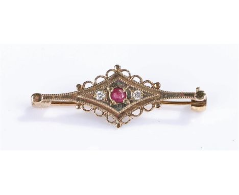 9 carat gold ruby and diamond brooch, with central ruby flanked by a diamond to each side, 2.3 grams