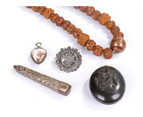 Chinese carved nut bead necklace, together with an ornate silver cigarette holder and case, Birmingham 1910, maker William Va