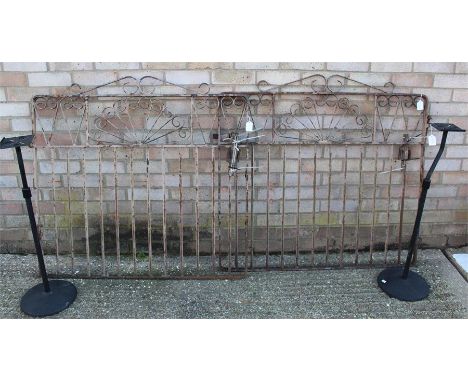 Pair of cast iron gates, each 105cm in width, together with a pair of speaker stands (4) 