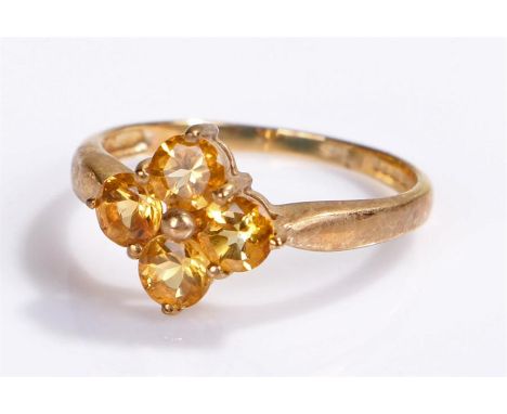 9 carat gold ring, with stones set to the head to form a flower