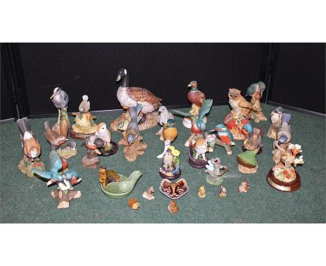 Six Wade miniature animals together with two other Wade figures and a quantity of ceramic bird figures including owls, woodpe