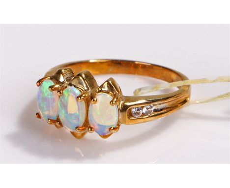 9 carat gold opal ring, with three opals, ring size O