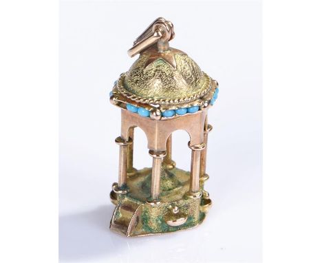 Yellow metal charm, possibly 14 carat in gold, blue enamel beading to top