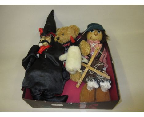 Steiff soft toy penguin, a Ritz Hotel teddy bear and two puppets