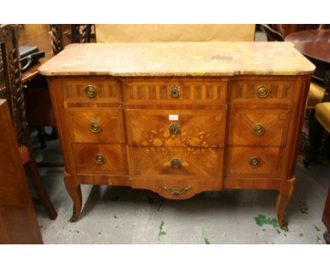 Continental kingwood and inlaid breakfront commode of three drawers raised on cabriole front supports