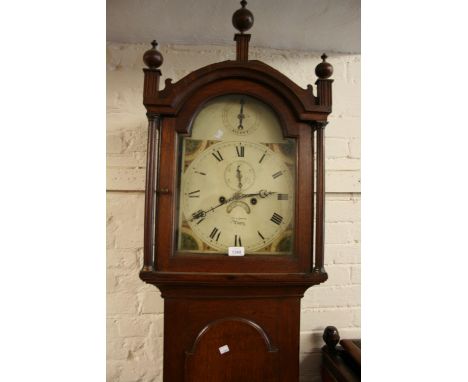 George III oak longcase clock, the broken arch hood above an arched panelled door and conforming plinth, the painted dial wit