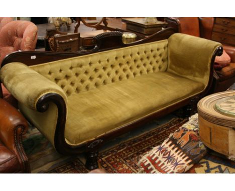 Late Regency mahogany double scroll end sofa with a button back on shaped supports